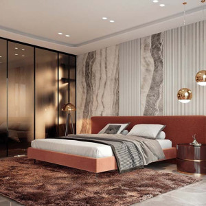 اتاق خواب مستر مدرن لوکس با تخت پارچه ای نارنجی و دیوار تاکیدی مرمری